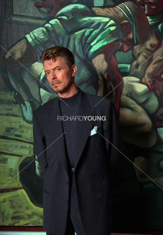 David Bowie with a Painting by Peter Howson, London, 1994